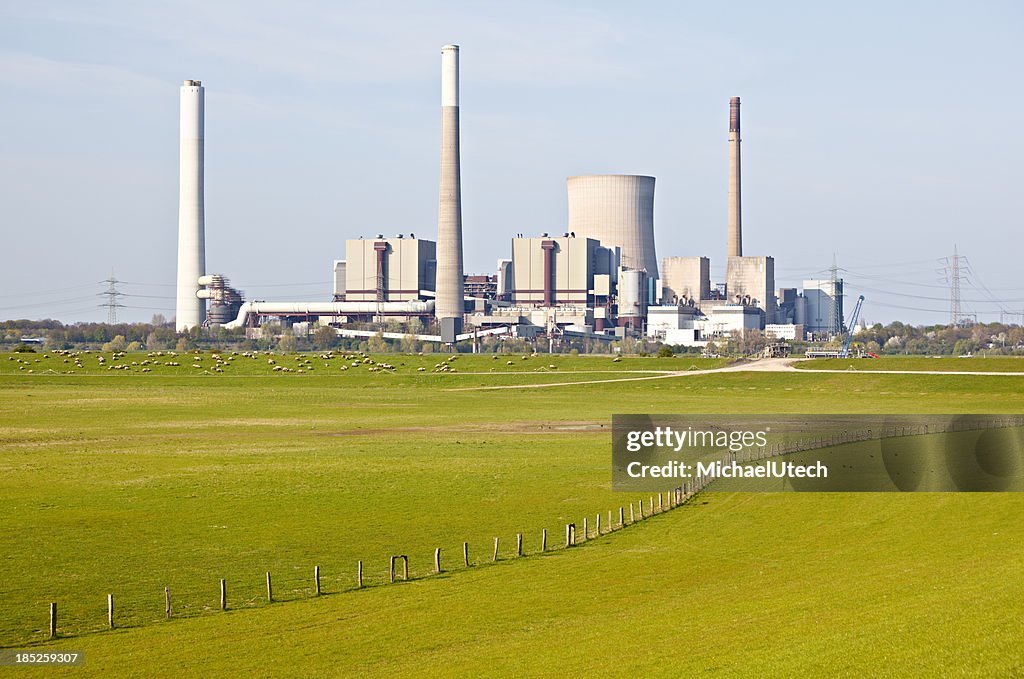 Farm In Front Of Industry Skyline