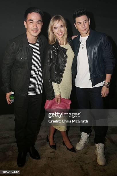 Joe Taslim, Suki Waterhouse and Dome attend the Burberry Brit Rhythm gig wearing Burberry on October 18, 2013 in Singapore.
