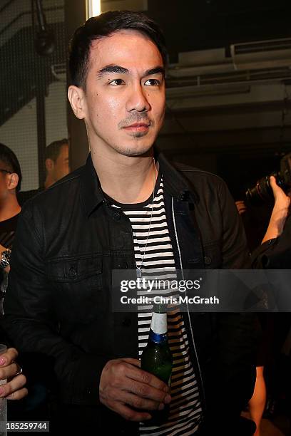 Joe Taslim, attends the Burberry Brit Rhythm gig wearing Burberry on October 18, 2013 in Singapore.