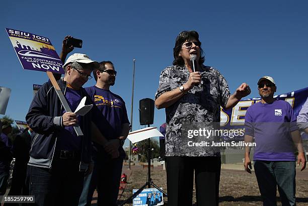Local 1021 president Roxanne Sanchez speaks to Bay Area Rapid Transit workers during a rally in front of the Lake Merritt BART station on the first...