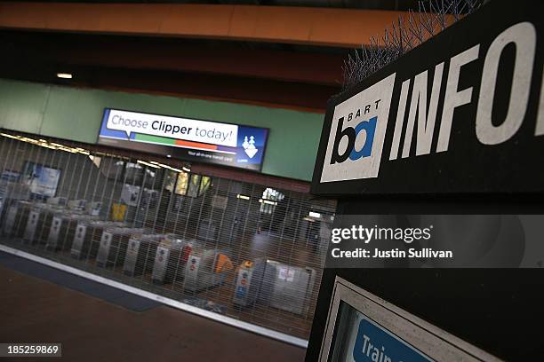 Pay gates at the Fruitvale Bay Area Rapid Transit station are seen behind a locked gate on the first day of the BART strike on October 18, 2013 in...