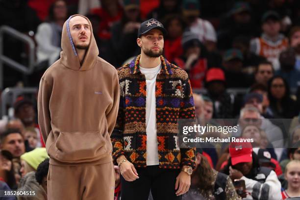 Alex Caruso and Zach LaVine of the Chicago Bulls look on against the Denver Nuggets during the second half at the United Center on December 12, 2023...