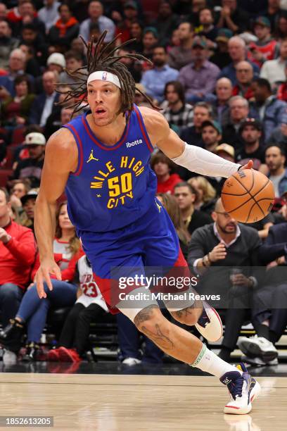 Aaron Gordon of the Denver Nuggets dribbles against the Chicago Bulls during the first half at the United Center on December 12, 2023 in Chicago,...