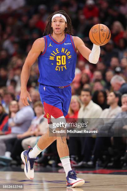 Aaron Gordon of the Denver Nuggets dribbles against the Chicago Bulls during the first half at the United Center on December 12, 2023 in Chicago,...