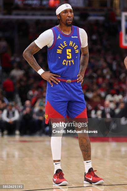 Kentavious Caldwell-Pope of the Denver Nuggets looks on against the Chicago Bulls during the first half at the United Center on December 12, 2023 in...