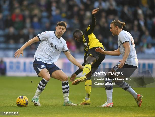 Preston North End's Jordan Storey and Brad Potts battles with Watford's Ken Sema during the Sky Bet Championship match between Preston North End and...