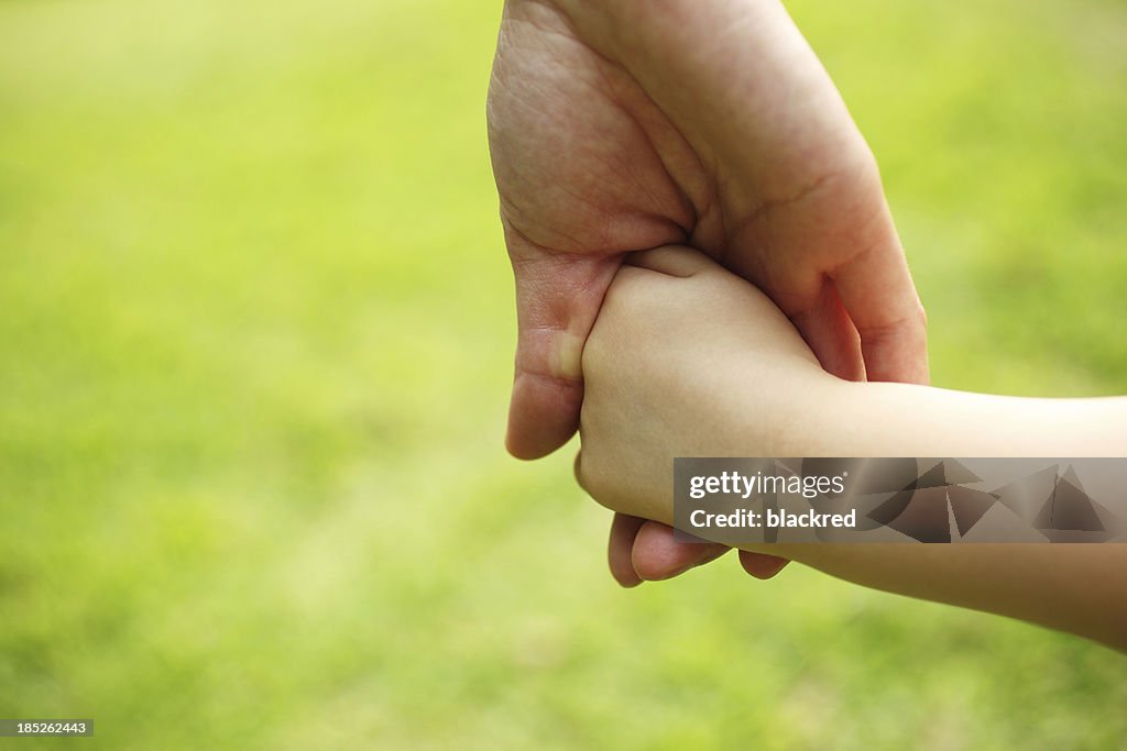 Mother and Child Holding Hands