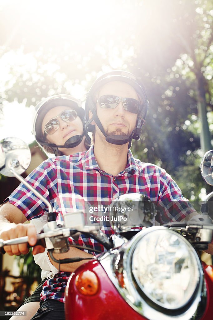 Young couple with scooter