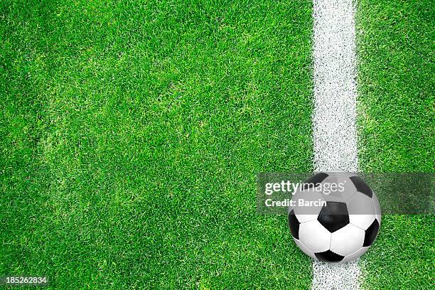 soccer ball on green grass - soccer field above stock pictures, royalty-free photos & images