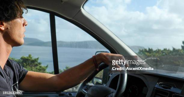young man drives car along the seaside - ligurian sea stock pictures, royalty-free photos & images