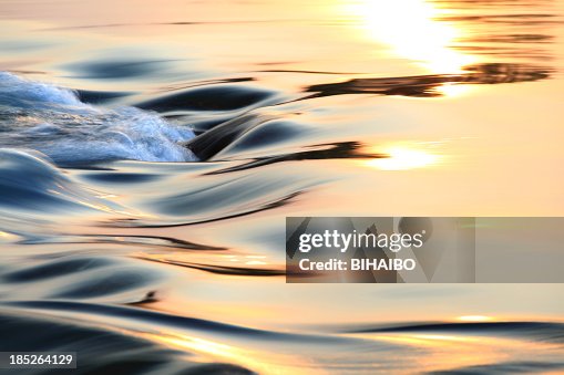 Light reflecting on flowing water Light reflecting on flowing water