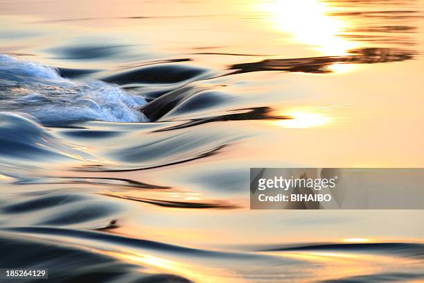 light reflecting on flowing water - river stock pictures, royalty-free photos & images