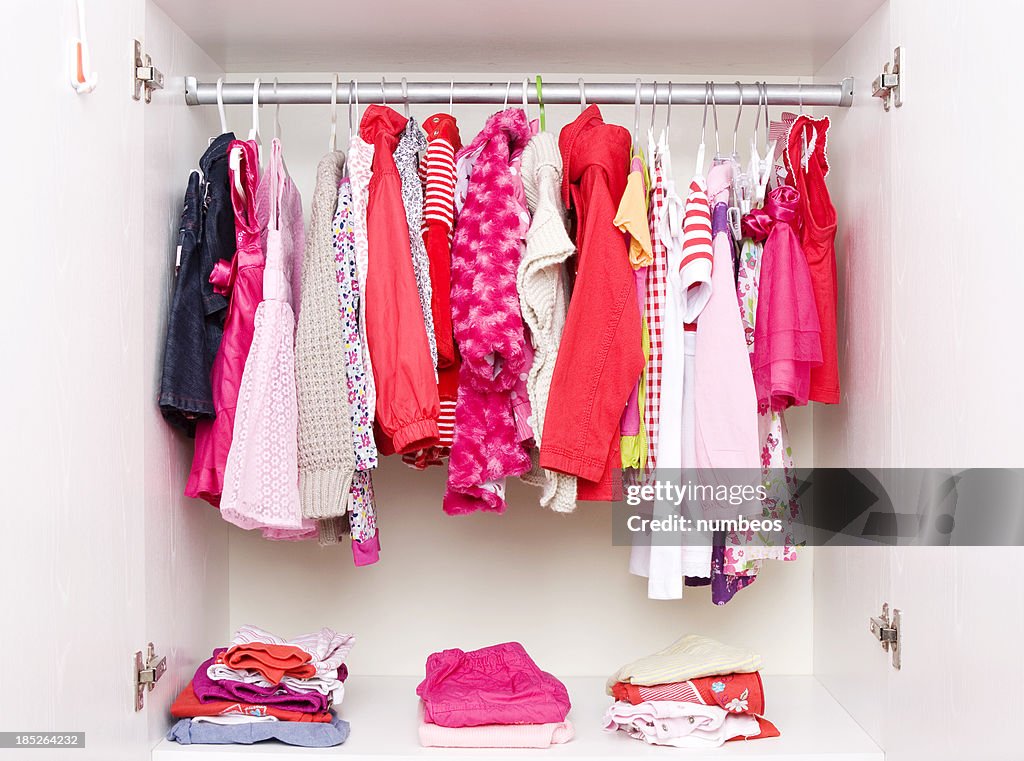 Closet filled with girls clothing 