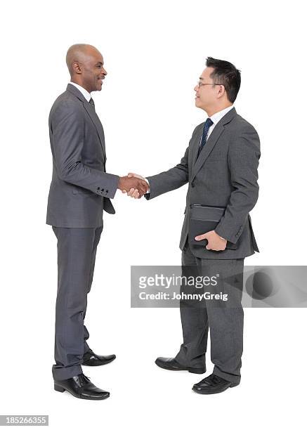 business deal between different ethnicity - handshake isolated stock pictures, royalty-free photos & images