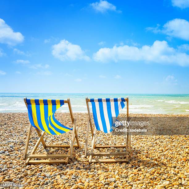 two deckchair in brighton beach at summer - brighton deckchair stock pictures, royalty-free photos & images