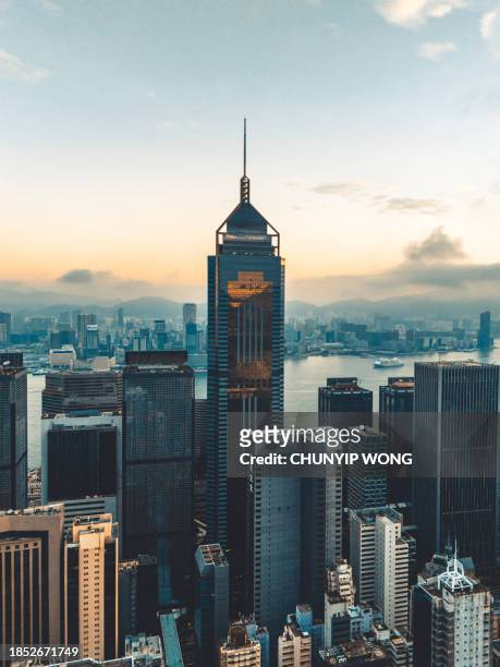 hong kong viewed from the drone with city skyline of crowded skyscrapers. - hong kong skyline drone stock pictures, royalty-free photos & images