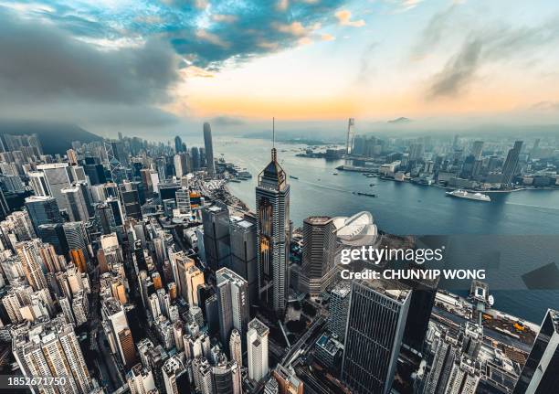 hong kong viewed from the drone with city skyline of crowded skyscrapers. - wan chai stock pictures, royalty-free photos & images