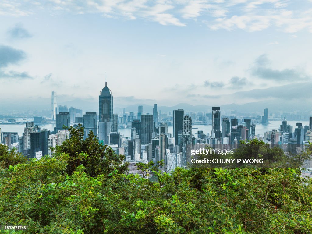 Hong Kong viewed from the drone with city skyline of crowded skyscrapers.