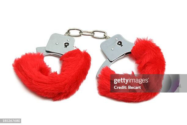 romantic red handcuffs - fuzzy handcuffs stock pictures, royalty-free photos & images