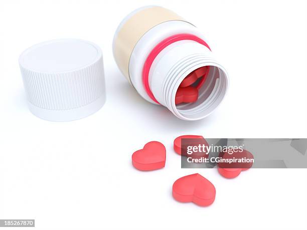 bottle and heart shape bills - heart pill stockfoto's en -beelden