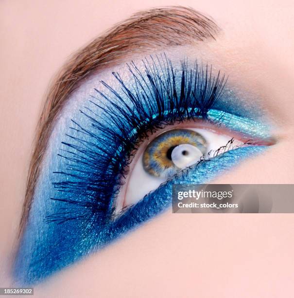 blue eye - extreme close up of bright blue eye and iris stock pictures, royalty-free photos & images
