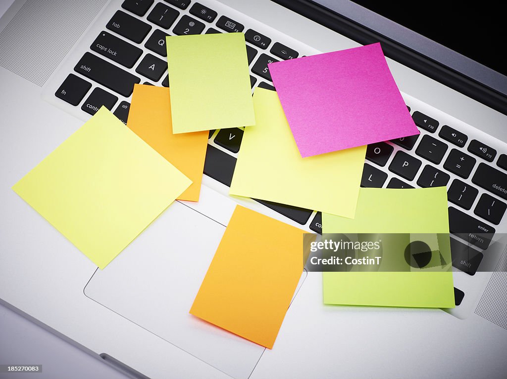 Post-it notes on laptop keyboard