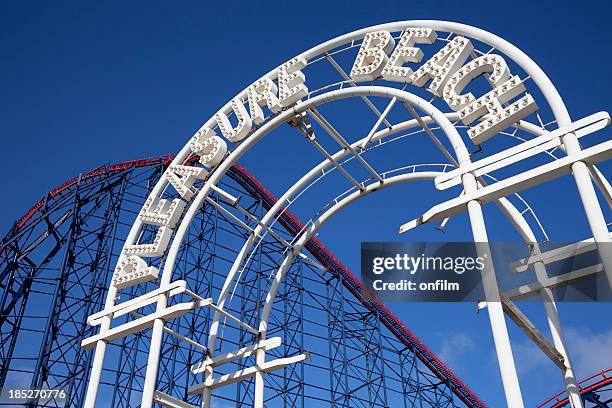 amusement park entrance with rollercoaster - entrance sign stock pictures, royalty-free photos & images