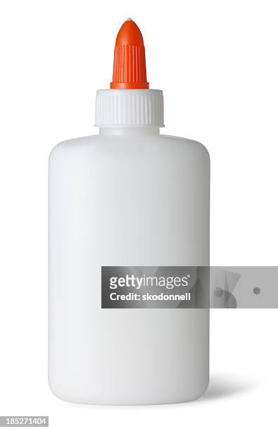 glue bottle on white - adhesive stock pictures, royalty-free photos & images