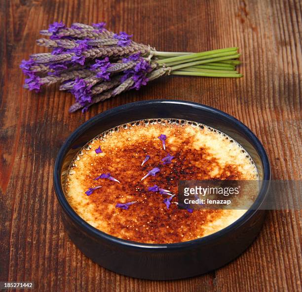 creme brulee with lavender flowers - creme brulee stock pictures, royalty-free photos & images