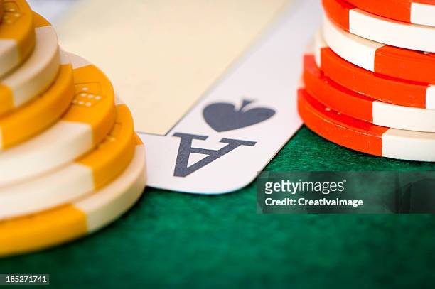 poker chips and a hand flip the cards - casino tables hands stock pictures, royalty-free photos & images