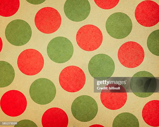 paper with large red and green dots - kerstpakpapier stockfoto's en -beelden