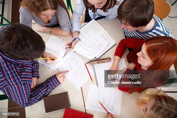 group of college students studying together - exam preparation stock pictures, royalty-free photos & images