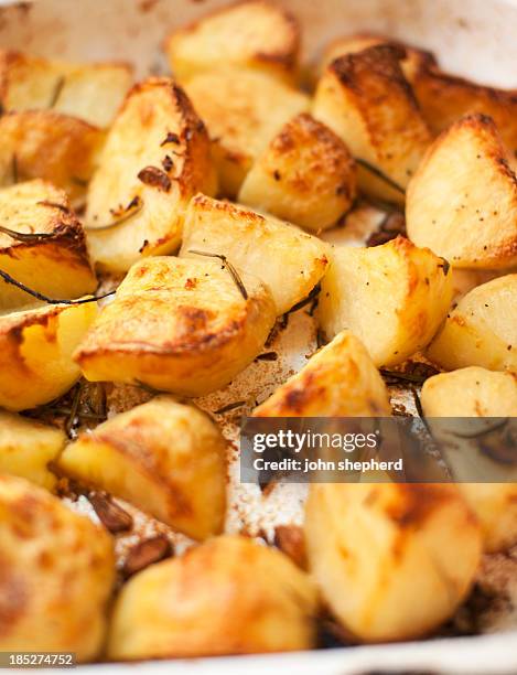 roast potatoes - roast potatoes stock pictures, royalty-free photos & images