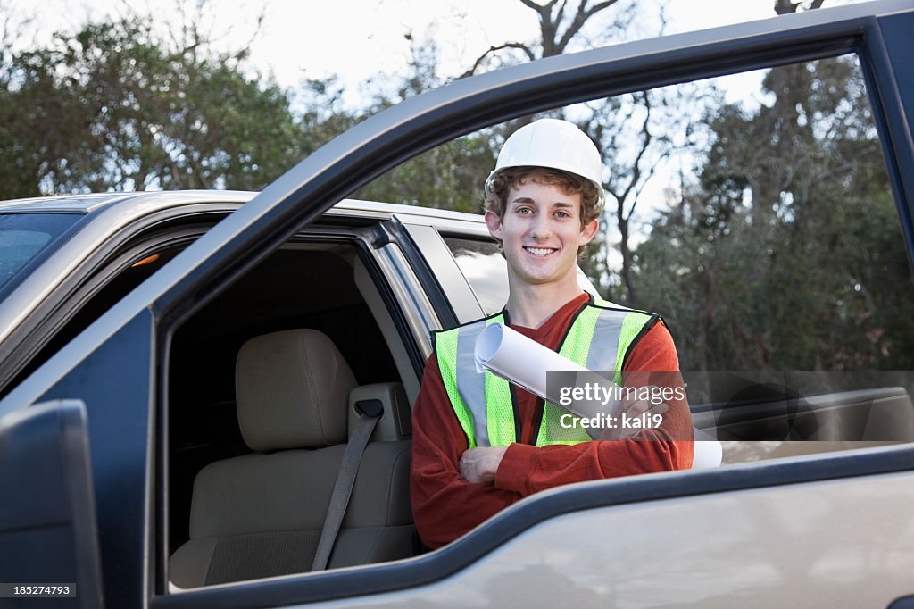 Manual worker wearing hardhat and safety vest