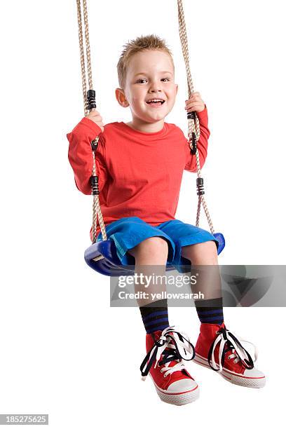 happy swinging boy - swing stock pictures, royalty-free photos & images