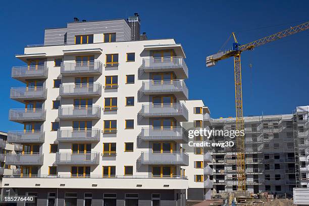 modern condominium buildings under construction - block flats stock pictures, royalty-free photos & images