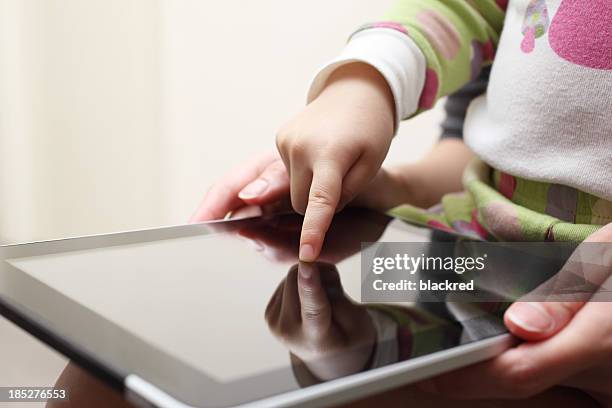 learning with touch screen tablet - baby hands pointing stock pictures, royalty-free photos & images