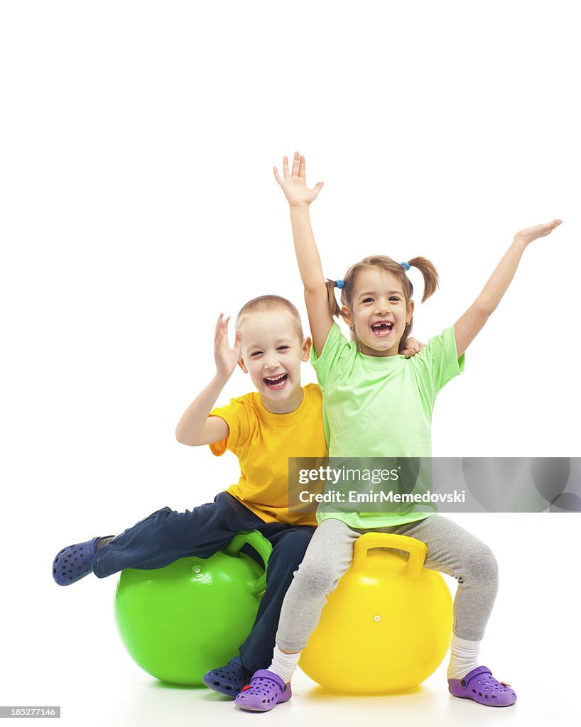 Heaving B Two Kids Heaving Fun With Bouncing Ball High-Res Stock Photo - Getty Images