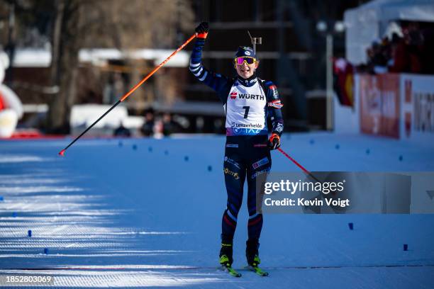 Justine Braisaz-Bouchet of France celebrate on her way to winning the Women 10 km Pursuit at the BMW IBU World Cup Biathlon Lenzerheide on December...