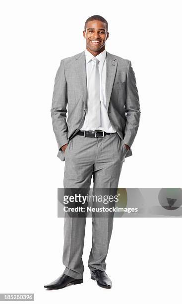 businessman with hands in pockets - isolated - businessman in black suit stock pictures, royalty-free photos & images