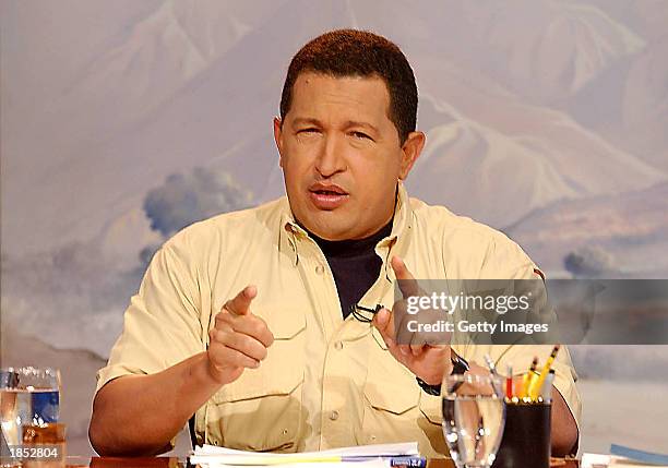 Venezuelan President Hugo Chavez speaks during his radio and television program "Hello President", broadcast from Miraflores presidential palace...