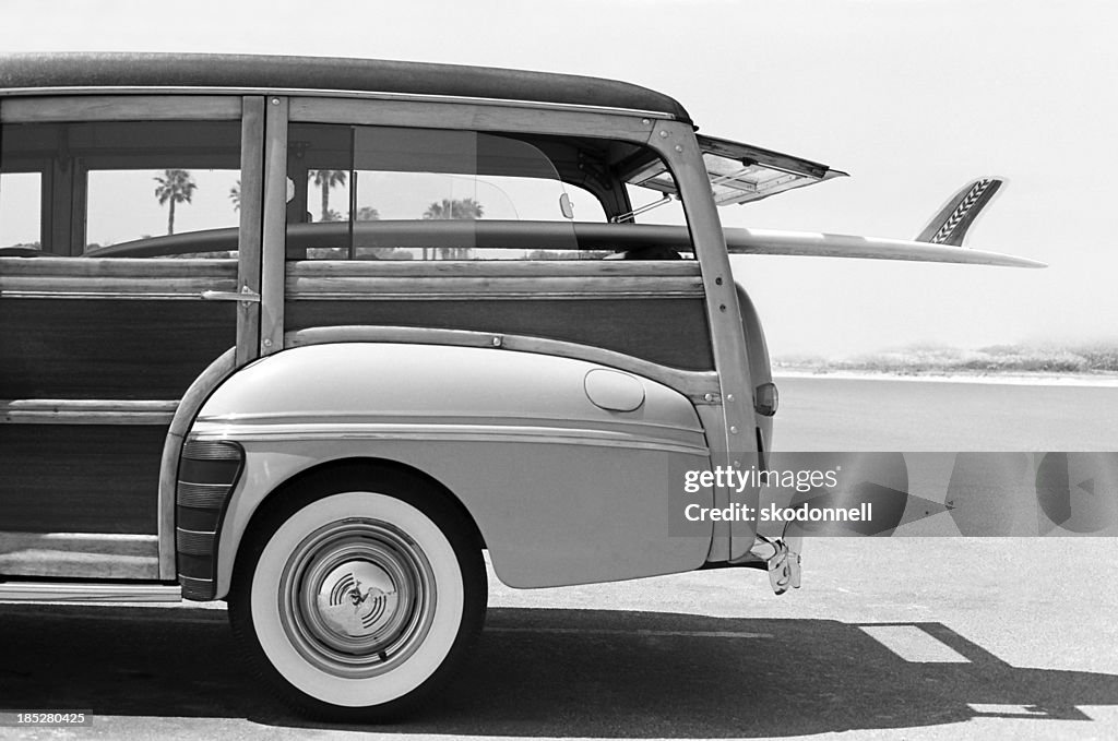 Old Woodie Station Wagon with Surfboard