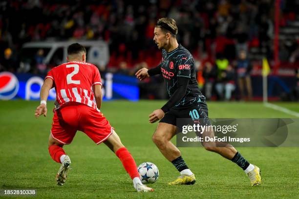 Kosta Nedeljkovic of FK Crvena Zvezda and Jack Grealish of Manchester City battle for the ball during the UEFA Champions League match between FK...