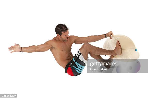 man surfing on a surfboard - unbalance stockfoto's en -beelden