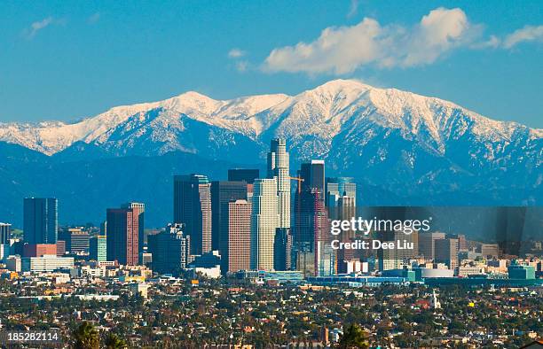 los angeles skyline and san gabriel mountains - us bank tower stock pictures, royalty-free photos & images