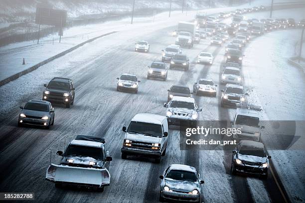 schlechtes wetter fahren - snow covered road stock-fotos und bilder