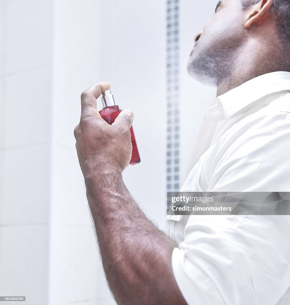 Man spraying aftershave