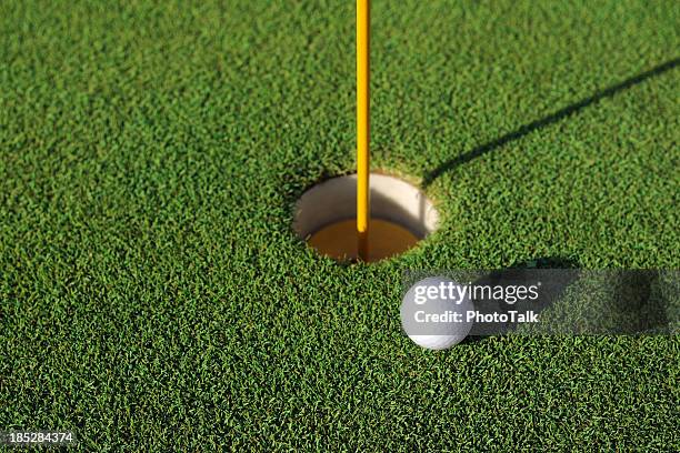 golf ball close to the hole - xlarge - missed chance stock pictures, royalty-free photos & images