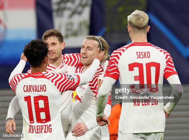 Emil Forsberg of RB Leipzig celebrates with teammates after scoring their team's second goal during the UEFA Champions League match between RB...