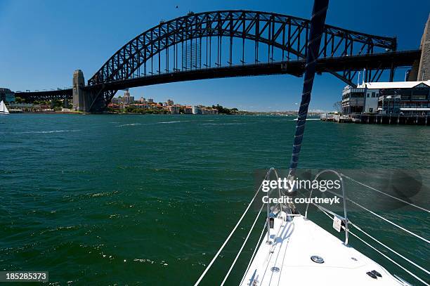 view of sydney harbour bridge from a boat - sydney harbour boats stock pictures, royalty-free photos & images